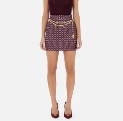 Elisabetta Franchi Tailleur|Skirts|Crêpe miniskirt with diamond print and chain RougeNoir/Butter